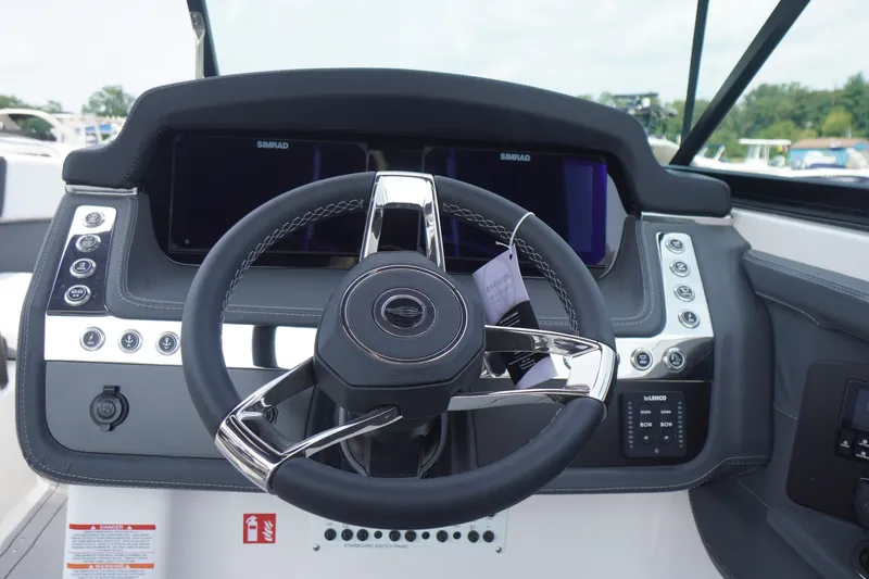 Slide: The Image of Steering console of 2027 Chaparral 270 OSX boat with modern controls and displays. - 30