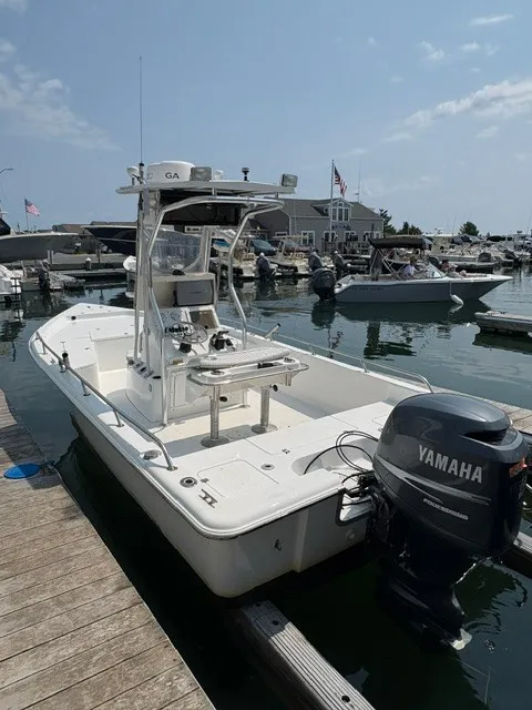 Slide: The Image of 2004 Sea Pro SV2100CC Bay Boat docked with a Yamaha outboard motor. - 1