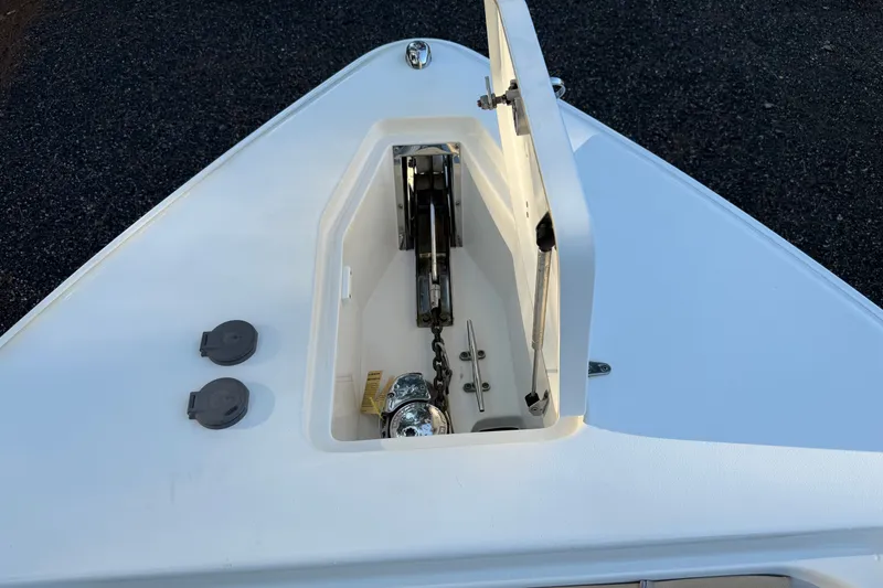Slide: The Image of Anchor compartment of 2018 Sea Hunt Gamefish 27 boat, open hatch view. - 36