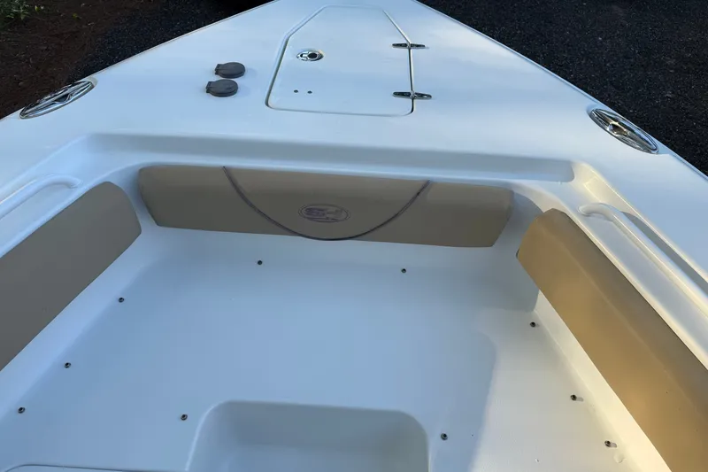 Slide: The Image of 2018 Sea Hunt Gamefish 27 boat interior with cushioned seating and storage compartments. - 35