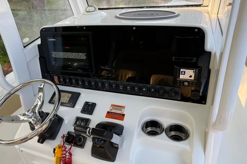 Slide: The Image of 2018 Sea Hunt Gamefish 27 helm with Garmin display and controls. - 46