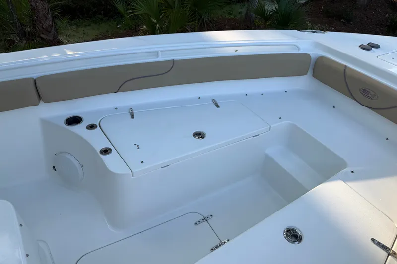 Slide: The Image of 2018 Sea Hunt Gamefish 27 boat interior with seating and storage compartments. - 34