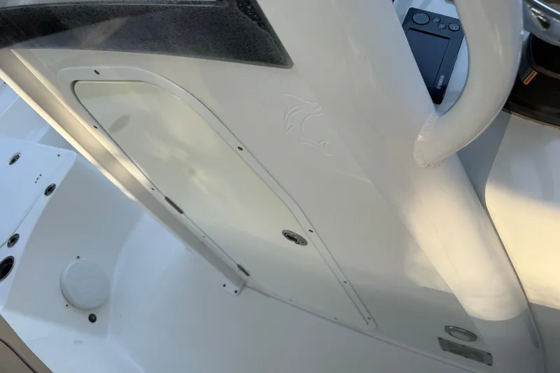 Slide: The Image of 2018 Sea Hunt Gamefish 27 boat interior, featuring a sleek white console design. - 41