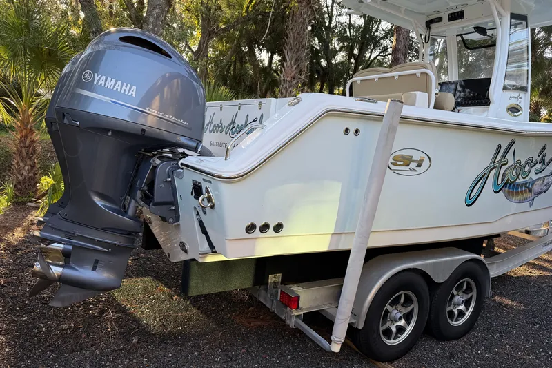 Slide: The Image of 2018 Sea Hunt Gamefish 27 boat with Yamaha outboard motor on trailer. - 14