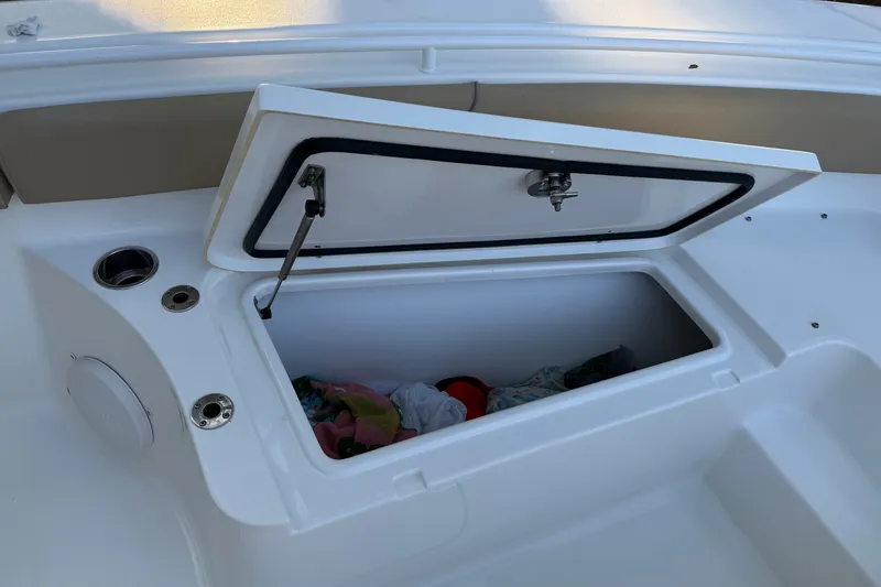 Slide: The Image of Open storage compartment on 2018 Sea Hunt Gamefish 27 boat deck. - 38