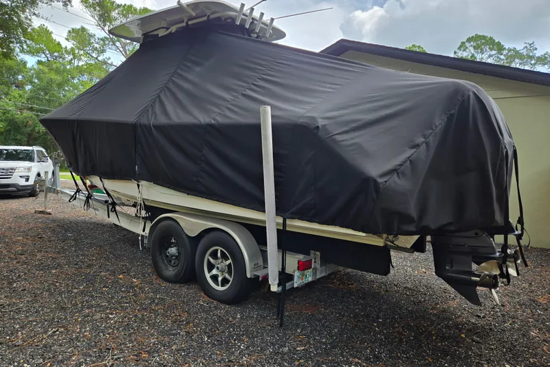 Slide: The Image of Covered 2018 Sea Hunt Gamefish 27 boat on trailer in outdoor setting. - 52