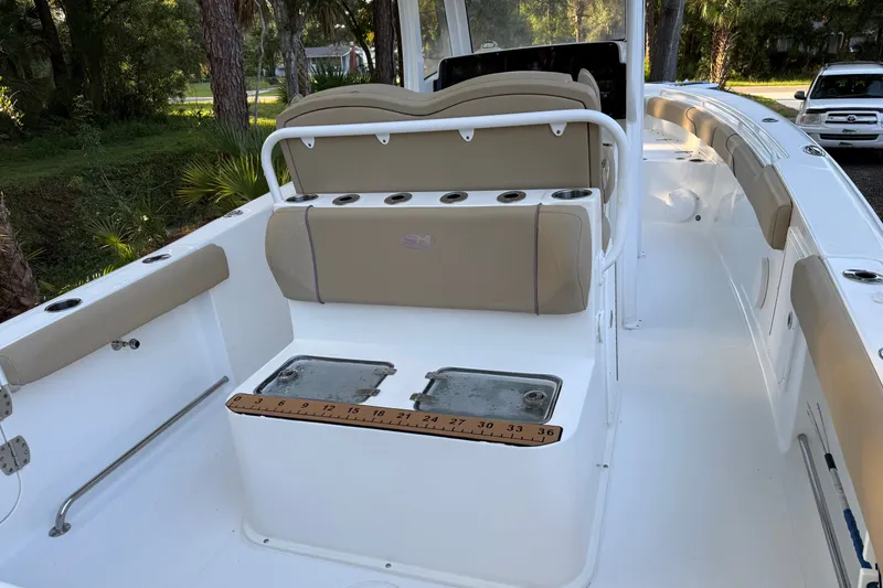Slide: The Image of 2018 Sea Hunt Gamefish 27 boat interior with seating and storage compartments. - 16