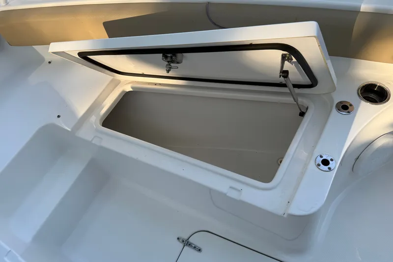 Slide: The Image of Open storage compartment on a 2018 Sea Hunt Gamefish 27 boat. - 37
