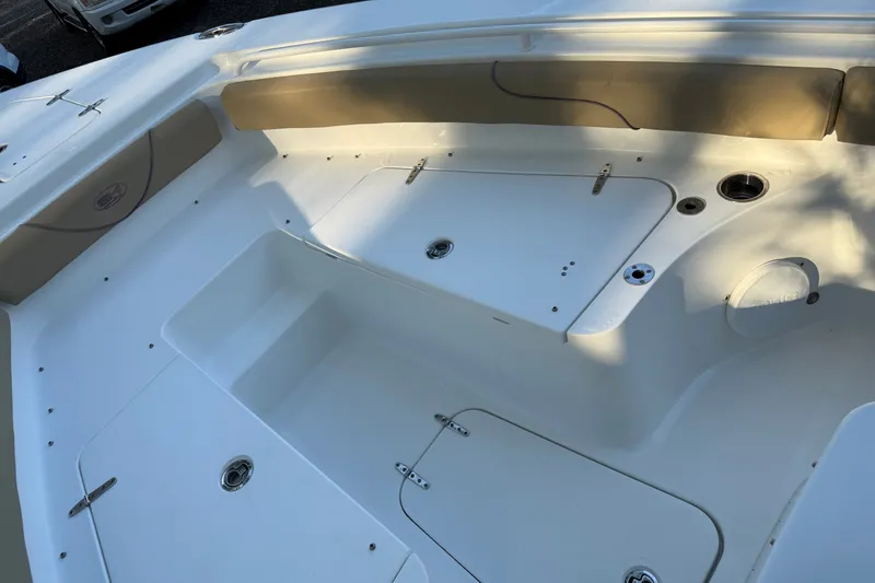Slide: The Image of 2018 Sea Hunt Gamefish 27 boat interior with storage compartments and seating. - 33