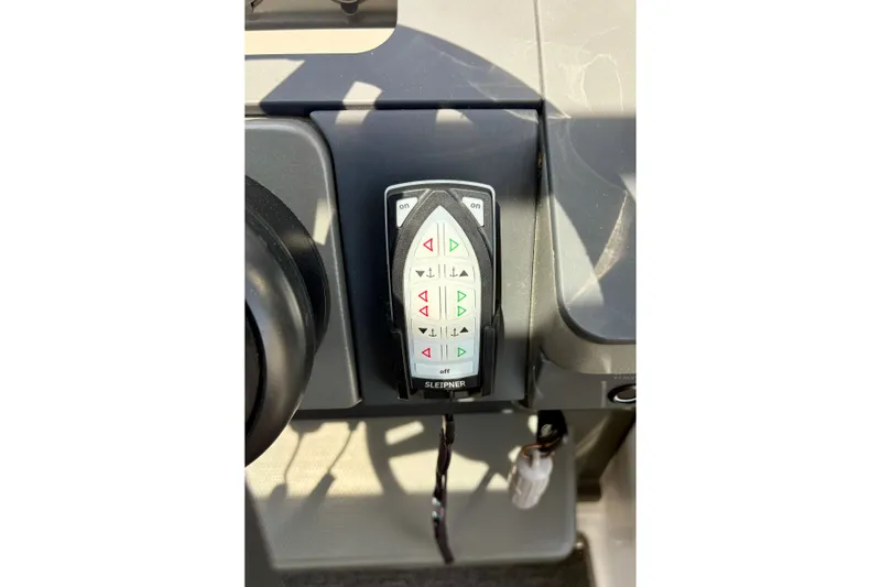 Slide: The Image of Control panel of 2024 Nimbus Commuter 9 with buttons and keychain. - 14