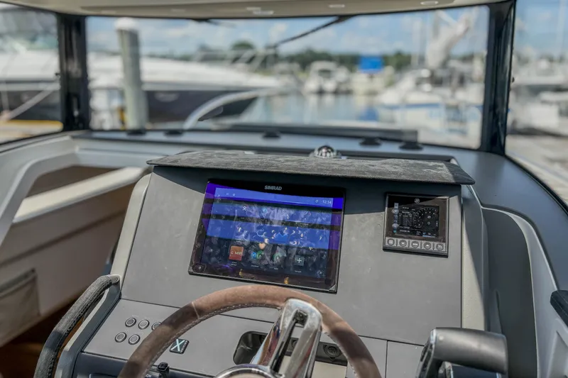 Slide: The Image of 2024 Nimbus Commuter 9 dashboard with navigation display and steering wheel. - 13
