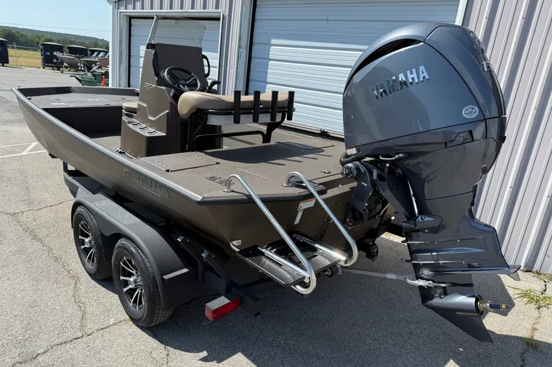 Slide: The Image of 2027 Avid 20 Rogue CC boat with Yamaha outboard motor on trailer. - 2