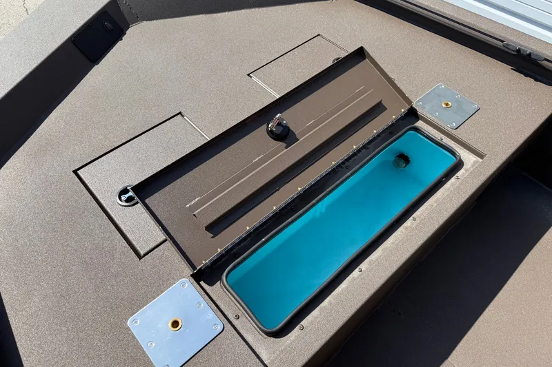 Slide: The Image of Open storage compartment on 2027 Avid 20 Rogue CC boat deck. - 8