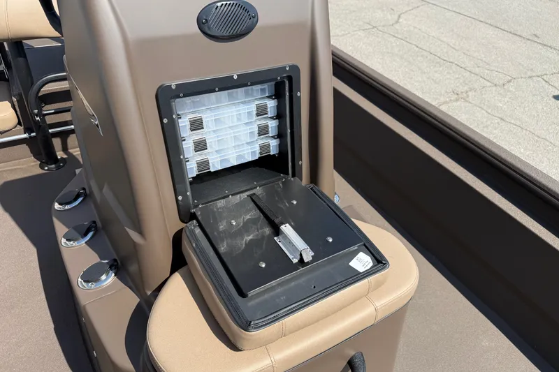 Slide: The Image of Open storage compartment on 2027 Avid 20 Rogue CC boat console. - 12