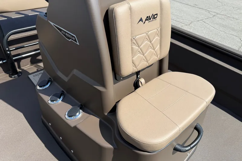 Slide: The Image of Avid 20 Rogue CC 2027 boat seat with beige upholstery and logo detailing. - 10