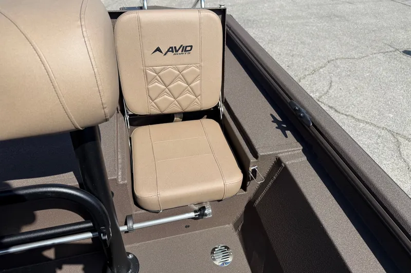 Slide: The Image of 2027 Avid 20 Rogue CC boat seat with beige upholstery and logo. - 14