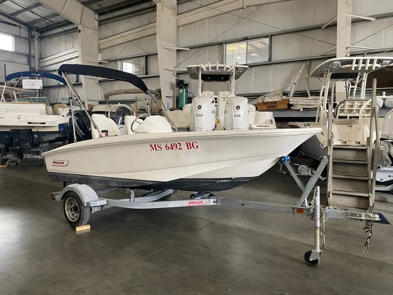 The Image of A 2017 Boston Whaler 130 Super Sport on a trailer in a warehouse setting. - 0