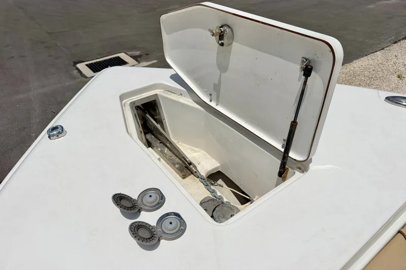 Slide: The Image of Open anchor hatch on 2016 Sea Hunt Gamefish 30 boat deck. - 32