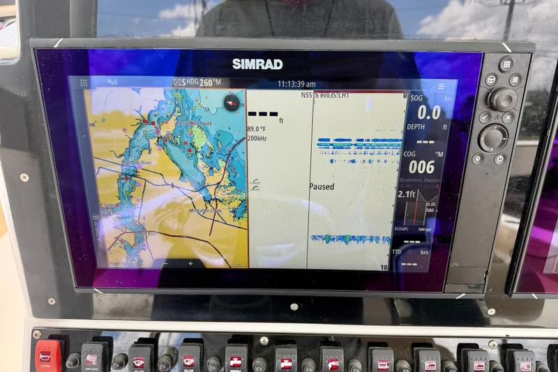 Slide: The Image of Simrad navigation display on 2016 Sea Hunt Gamefish 30 boat, showing marine map and sonar data. - 16