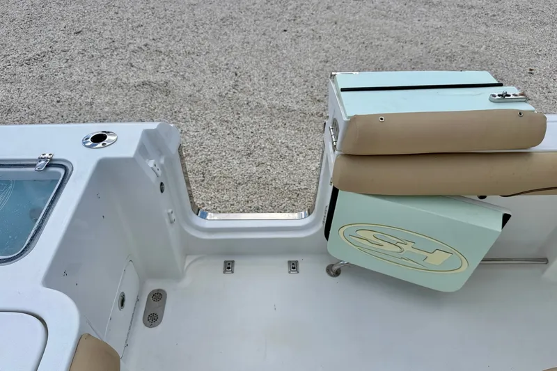 Slide: The Image of 2016 Sea Hunt Gamefish 30 boat interior with seating and storage compartment. - 31