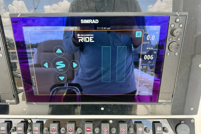 Slide: The Image of Simrad display on 2016 Sea Hunt Gamefish 30, showing Seakeeper Ride interface and controls. - 17