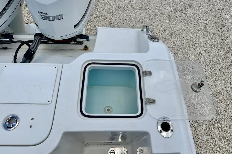 Slide: The Image of 2016 Sea Hunt Gamefish 30 boat with Yamaha 300 engines and open livewell. - 30