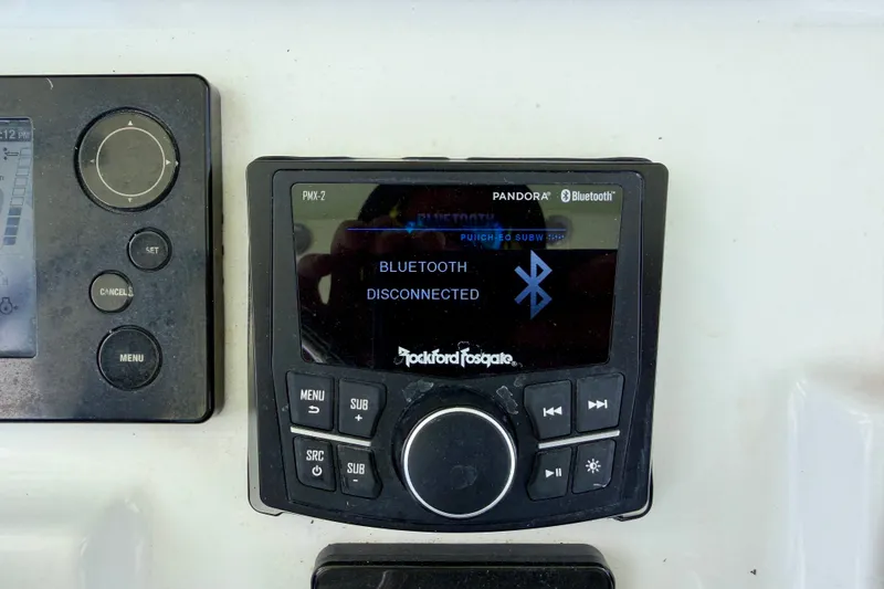 Slide: The Image of Control panel on a 2016 Sea Hunt Gamefish 30, showing Bluetooth disconnected. - 19