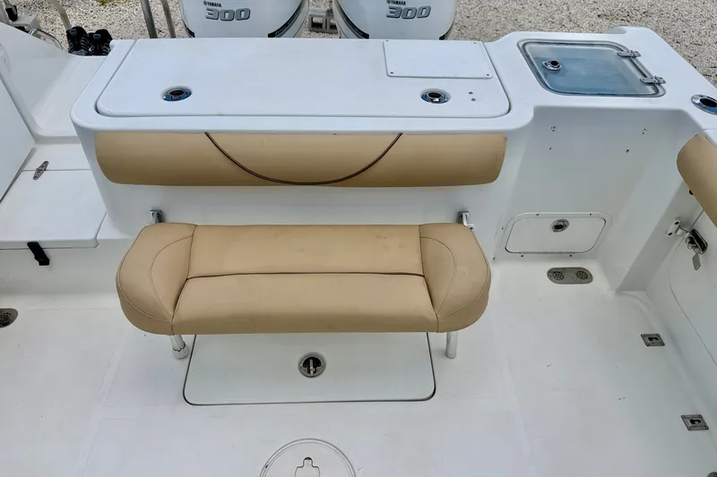 Slide: The Image of 2016 Sea Hunt Gamefish 30 boat interior with tan seating and Yamaha 300 engines. - 27