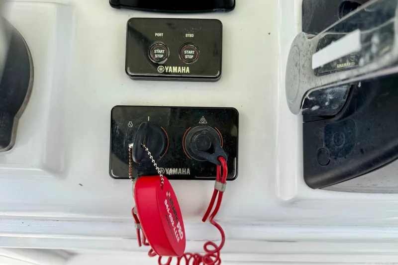 Slide: The Image of Control panel of a 2016 Sea Hunt Gamefish 30 with Yamaha start/stop switches. - 21