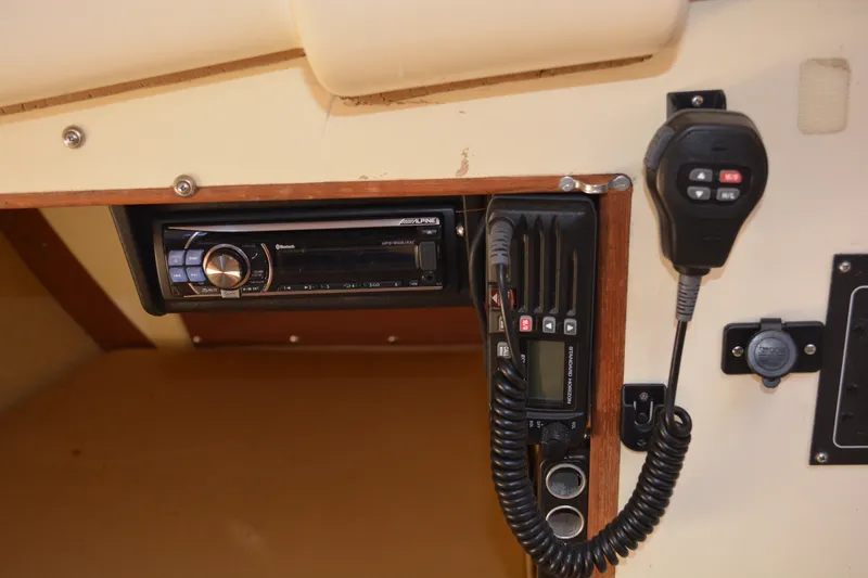 Slide: The Image of 1984 Pearson 303 boat interior with radio and communication equipment. - 18