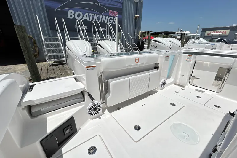 Slide: The Image of 2027 Sea Fox 328 Commander boat interior with seating and storage compartments. - 15