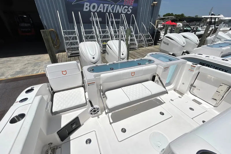 Slide: The Image of 2027 Sea Fox 328 Commander boat interior with seating and storage compartments. - 33