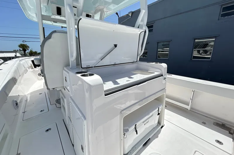 Slide: The Image of 2027 Sea Fox 328 Commander boat interior with storage and seating area. - 19