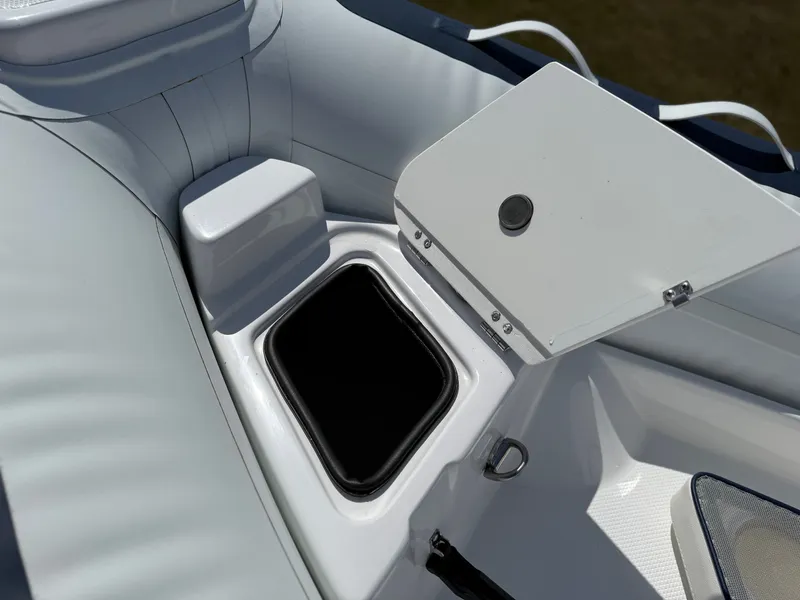 Slide: The Image of A 2026 Novurania 335DL with an open storage compartment in the bow area. - 15