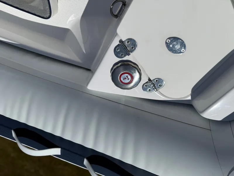 Slide: The Image of Close-up of a Novurania 335DL boat part with metal fittings and a valve. - 16