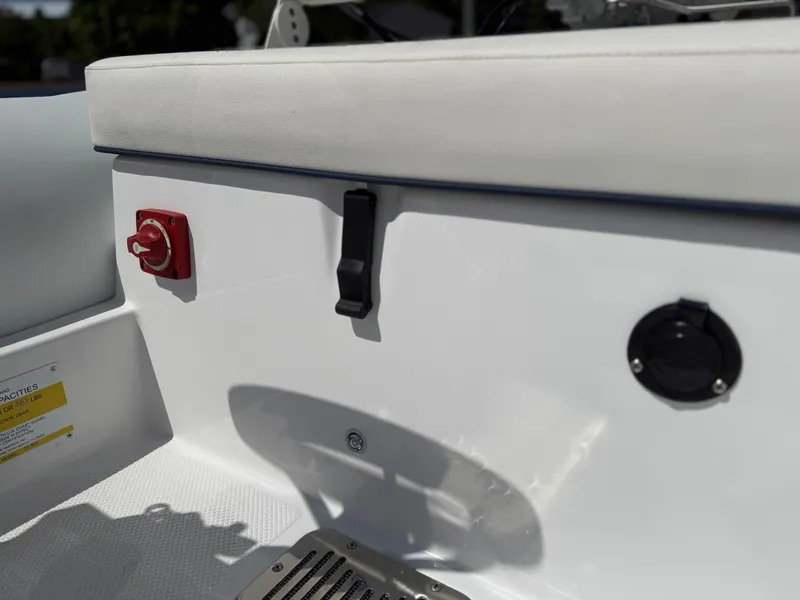 Slide: The Image of Close-up of a white boat deck with red and black switches. - 17