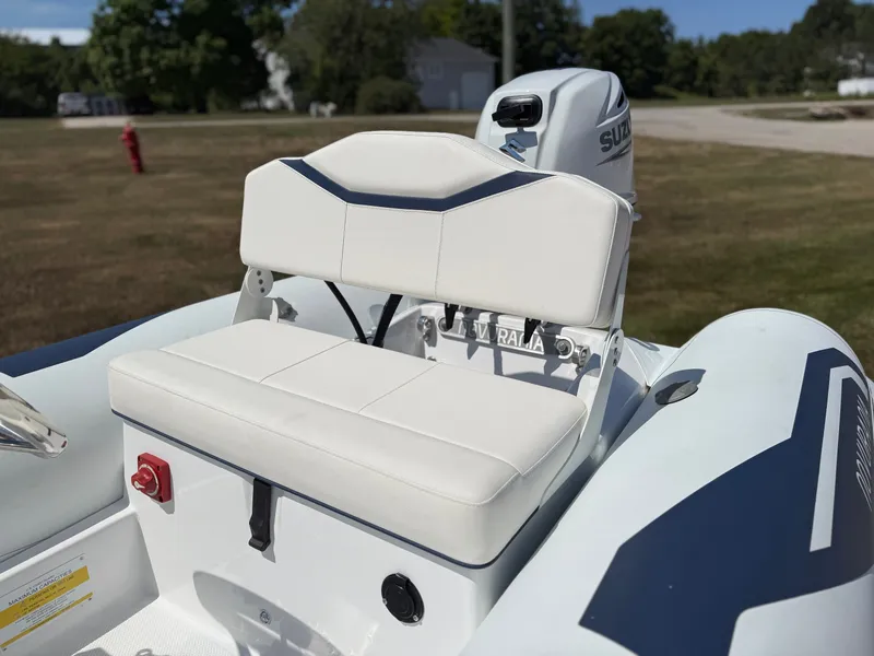 Slide: The Image of The image shows the cockpit of a 2026 Novurania 335DL with a white seat and Suzuki engine. - 19