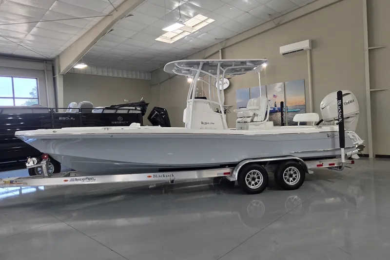 The Image of 2027 BlackJack 256 Coastal boat on trailer in showroom, side view. - 0