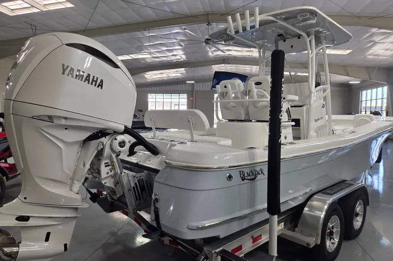 Slide: The Image of 2027 BlackJack 256 Coastal boat with Yamaha engine on trailer in showroom. - 4