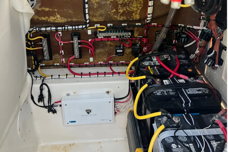 Slide: The Image of Electrical system of a 2000 Cobia 274 Center Console boat with batteries and wiring. - 16