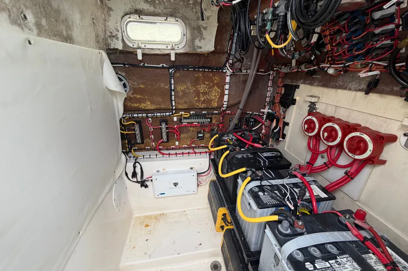 Slide: The Image of Electrical system of a 2000 Cobia 274 Center Console boat with batteries and wiring. - 25