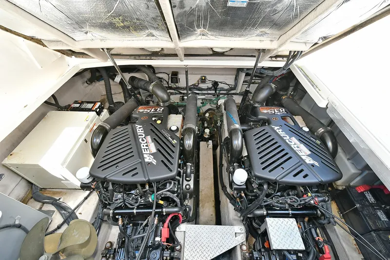 Slide: The Image of Engine compartment of a 2005 Sea Ray 340 Sundancer with twin MerCruiser engines. - 16