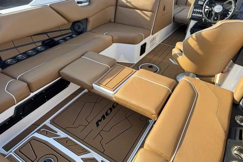 Slide: The Image of Luxurious interior of 2027 Moomba Max boat with tan leather seating and modern dashboard. - 11