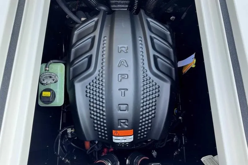 Slide: The Image of 2027 Moomba Max engine compartment featuring a Raptor engine cover. - 17