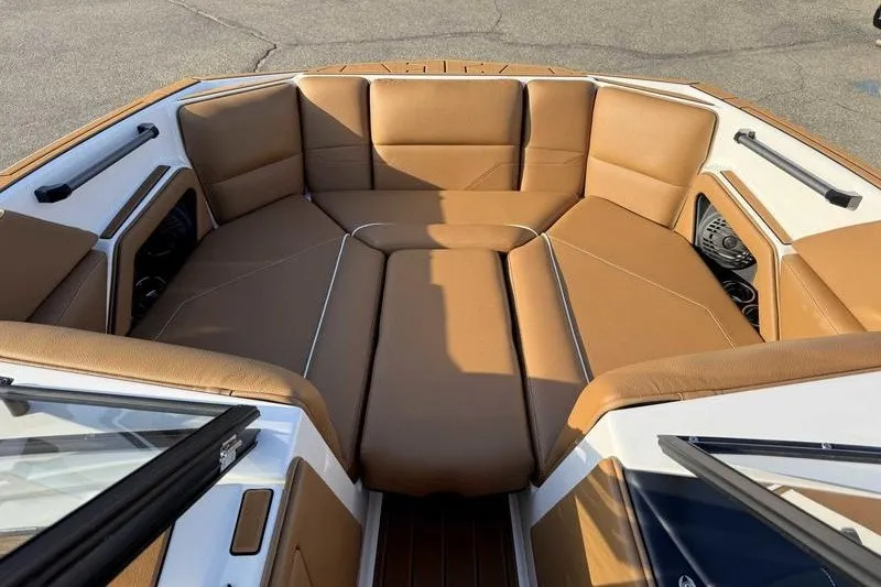 Slide: The Image of Luxurious seating in 2027 Moomba Max boat, featuring tan upholstery and modern design. - 10
