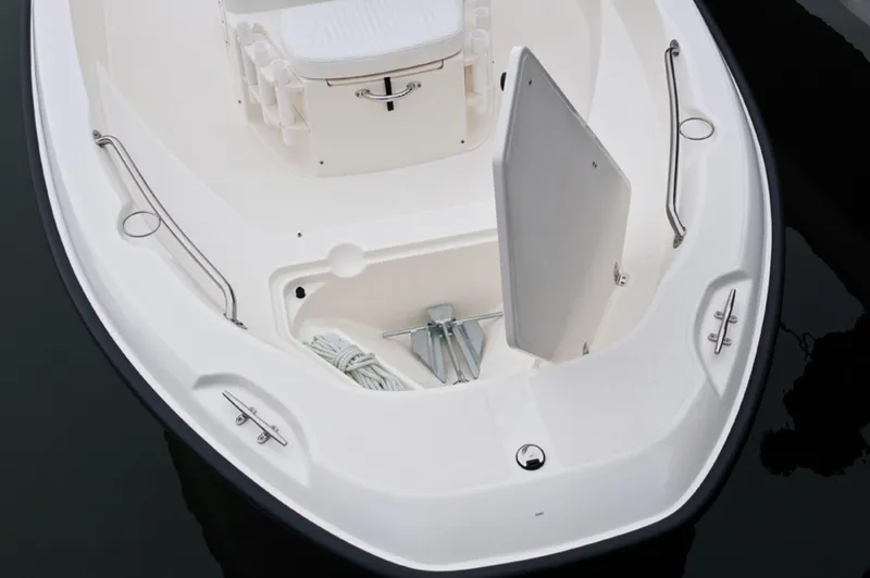 Slide: The Image of Manufacturer Provided Image: 2014 Boston Whaler 180 Dauntless bow storage compartment with anchor and rope. - 8