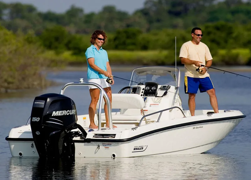 Slide: The Image of Manufacturer Provided Image: 2014 Boston Whaler 180 Dauntless boat with two people fishing on calm water. - 7