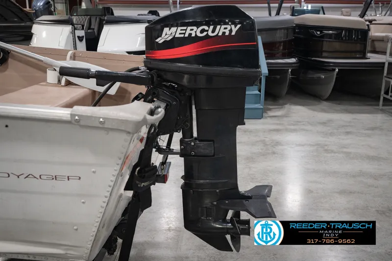 Slide: The Image of 2004 Smoker Craft Voyager boat with Mercury outboard motor in showroom. - 37