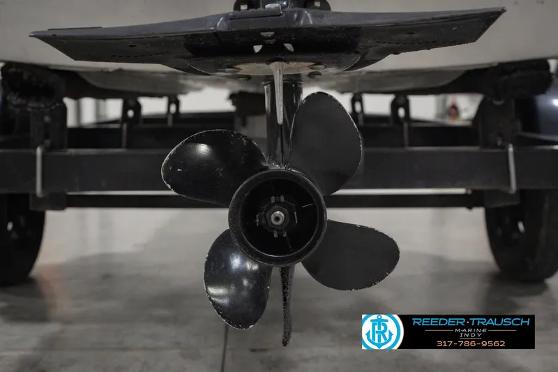 Slide: The Image of 2004 Smoker Craft Voyager boat propeller and trailer detail. - 40