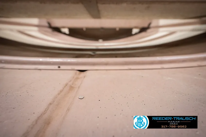 Slide: The Image of 2004 Smoker Craft Voyager boat underside view with Reeder-Trausch Marine logo. - 36